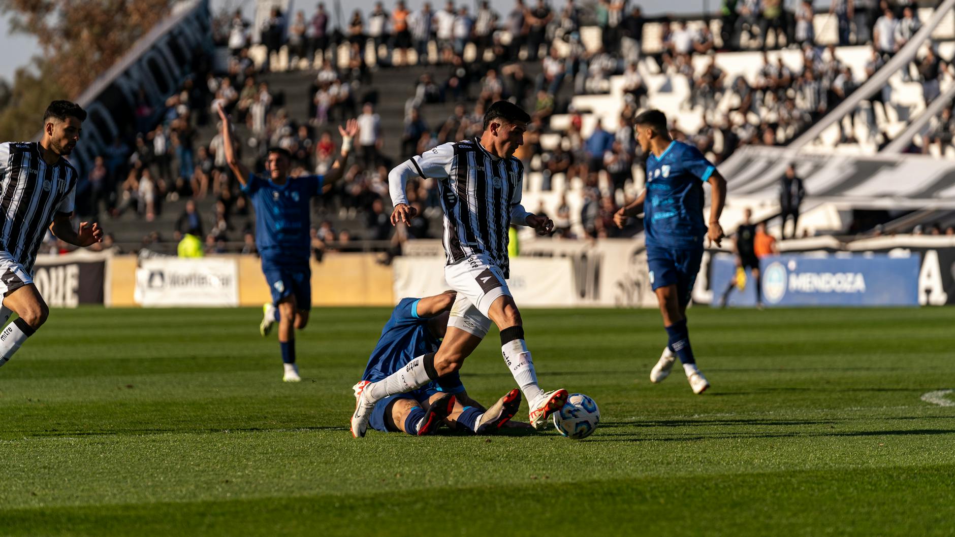 intense soccer match on bright green field