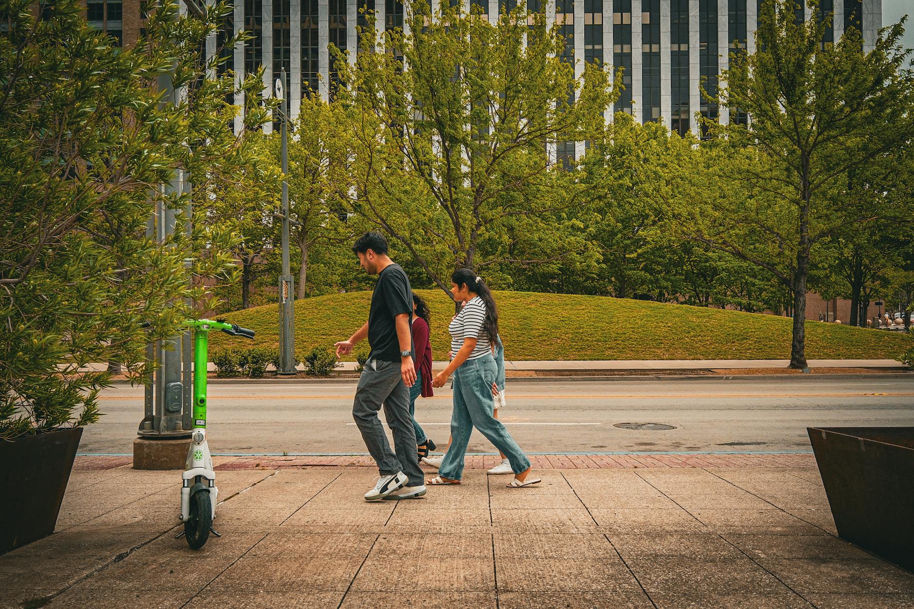 urban street scene with people and scooter